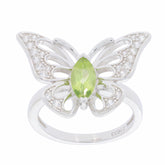 Elegant green peridot butterfly ring with diamond accents in sterling silver, perfect for a sophisticated touch.